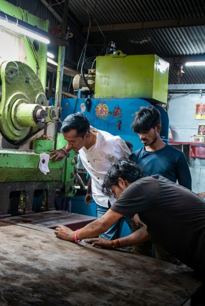 Workers operating an industrial machine